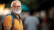 © Nataliia_Trushchenko - Man wearing glasses and a yellow shirt is smiling and holding a backpack. He is standing in front of a crowd of people
