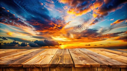 Fototapete - A Wooden Plank Tabletop Against a Dramatic Sunset Sky with Clouds in Vibrant Hues of Orange, Red, and Blue