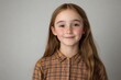 © Synthetica - A young girl with long brown hair and a plaid shirt is smiling