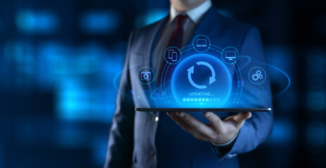 Wall Mural - businessman holding device with update icons on screen. software updating or upgrade concept