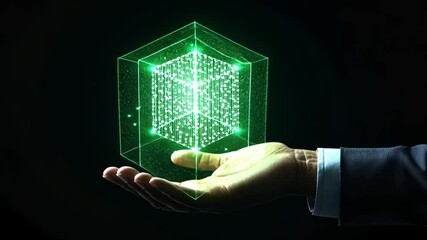 Wall Mural - hand holding holographic green cube display with digital particles and light effects for technology 