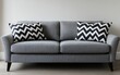 © Alfath - Modern gray sofa with black and white chevron pillows.