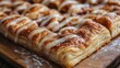 © AiPhotoSale - A delightful glazed pastry featuring a rich brown-sugar crust, adorned with smooth white icing atop a wooden surface. Its luscious layers promise sweet indulgence