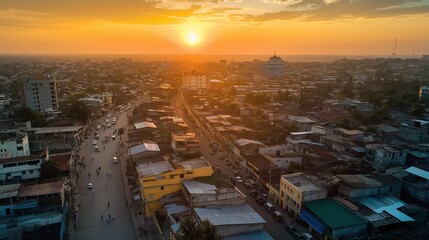 Poster - A bird's-eye view of a bustling city at sunset, with warm light illuminating the buildings
