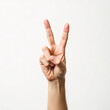 © Kamidrago - Hand making a peace sign gesture, symbolizing peace or victory in a simple, clear expression.