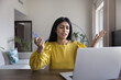 © fizkes - Indian woman looks at laptop screen with angry expression while holds card, try to make payment unsuccessfully, feels concerned due to additional fees or shipping costs during checkout, card limit