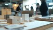 © kiki__ - Architectural model in studio with blurred figures of professional designers