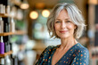 © vejaa - Portrait of sincerely smiling middle aged woman, small business owner, female company manager on blurred beauty store, spa, haircut salon background