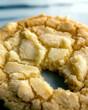 © V.Semeniuk - Golden Sugar Cookie Resting on a Minimalist Surface Highlighting Its Delightful Texture and Flavor