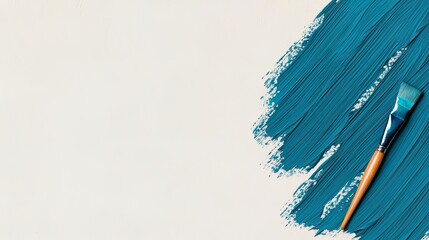Poster - Blue paintbrush rests on a white background with a blue paint stroke. The brush is leaning against the paint stroke, creating a sense of balance and harmony between the two elements
