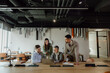 © Jovan - Professional Team Collaborating on a Project in a Modern Office Setting