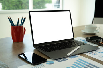 Wall Mural - laptop with blank screen on table. workspace background new project on laptop computer with blank co