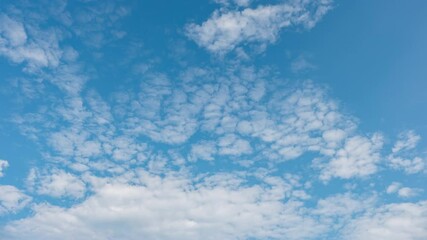 Wall Mural - Blue sky with fluffy cloud time lapse on a sunny day 4k footage.	
