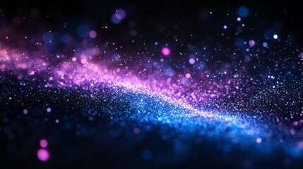 Subtle blue and violet particles expanding outward, creating a gradient effect on black