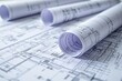 © PlanetOfVectors - Detailed architectural blueprints with rolled-up plans on a table, creating a professional background. Concept of engineering, construction, and creative design. Ai generative