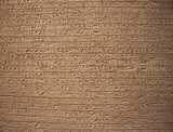 ancient Egyptian carvings and hieroglyphs on sand stones at the Grand Egyptian Museum in Cairo, Egypt
