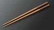 © isend - Two wooden chopsticks positioned diagonally over a dark surface