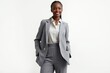 © ThomasLENNE - Half-Length (Waist-Up) portrait of young stylish smiling Guinea-Bissauan female model in business wear isolated on pure white background looking at camera