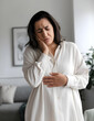 © Anna - Young woman suffering from severe abdominal pain at home