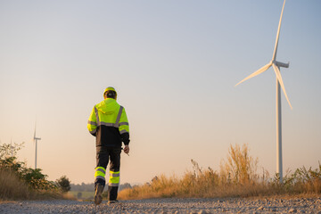 Aufkleber - Engineer man working at windmill farm Generating electricity clean energy. Wind turbine farm generator by alternative green energy.