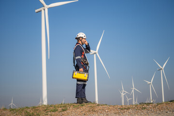 Aufkleber - Engineer man working at windmill farm Generating electricity clean energy. Wind turbine farm generator by alternative green energy.