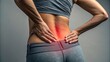 © Media Srock - Lower Back Pain: A Woman Holding Her Aching Lower Back