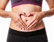 © Anna - Close up of woman's hands made heart on belly isolated on white background.health care concept.