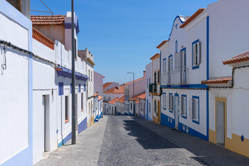 Naklejka na meble Street of the beautiful fishing village of Vilanova de Milfontes in the Alentejo region of Portugal in a sunny day.