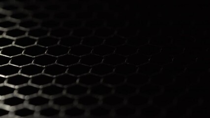dark metallic hexagonal grid with dramatic lighting
