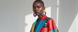 © Den Boro Day - Fashion model wearing colorful patchwork jacket and big earrings.