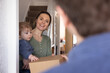 © ReeldealHD images - Mom Smiling with Baby receiving a home delivery