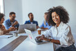 © Dragana Gordic - Smiling Professional at a Collaborative Business Meeting in Bright Office Space