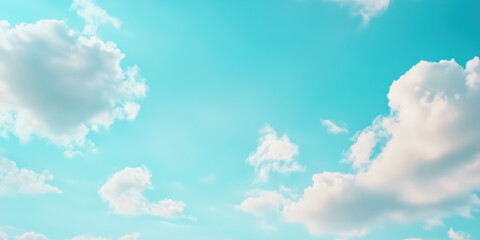 a serene view of a light blue sky dotted with fluffy white clouds. the peaceful and airy scene evoke
