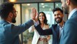 © miss irine - Indian business professionals celebrate success with high-five in workspace. Smiling team in modern office. Colleagues give high five. Achievement milestone. Indian culture, ethnic diversity