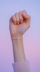 Wall Mural - realistic photograph of a hand with a fist featuring delicate fingers and a soft background
