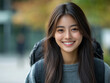 © Bohdan - Young woman smiles while exploring an urban area