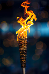 Poster - Blazing torch against blue background