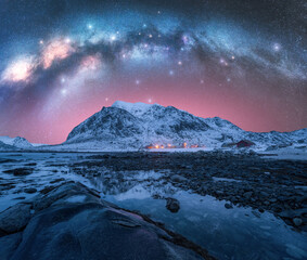Wall Mural - night starry sky with milky way arch, stones in water. winter landscape with milky way and stars, ro