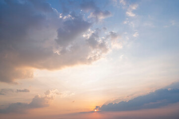 Wall Mural - sunset / sun rise sky with rays of light shining clouds and sky background and texture