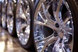 © Василина Ільків - Shiny chrome wheels in a row with blurred background