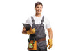 © Ljupco Smokovski - Repairman with a tool belt holding a clipboard
