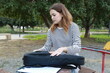 © Polonio Video - Girl Puts The Musical Instrument Ukulele In The Case Outdoor In Park