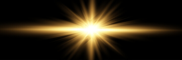 Wall Mural - golden light burst with lens flare on black background