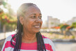 © Sabrina - Happy senior african woman having fun during city trip vacation at sunset - Elderly person and urban lifestyle concept - Copy space