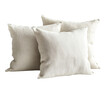 © akun - Three cream-colored linen throw pillows