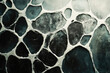 © Vibudhaart - Abstract dark stone wall texture with white grout lines, creating a unique pattern.