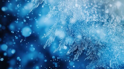 Wall Mural - beautiful blue winter background with falling snowflakes and icy patterns creating a serene, festive