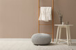 © New Africa - Stylish room interior with pouf, ladder and decor elements. Space for text