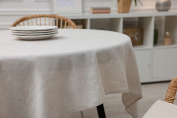 Poster - table with white tablecloth and plates in room, closeup