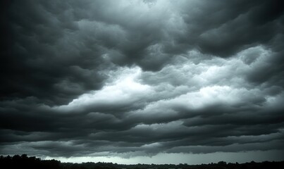 dark storm clouds over landscape, ominous weather, nature backdrop for weather report or drama